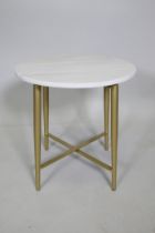 A contemporary stone topped occasional table with gilt metal legs, 44cm high x 43cm diameter