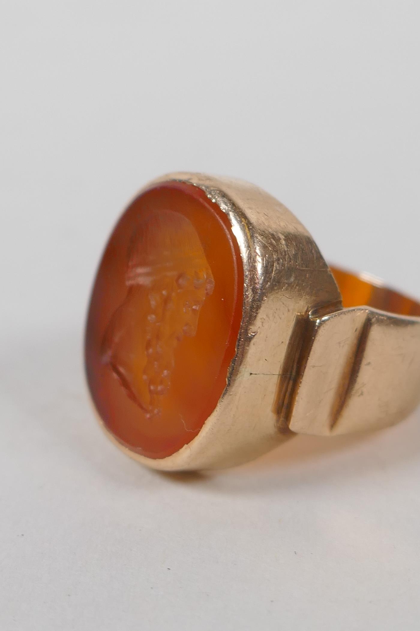 An antique intaglio ring, with finely carved inset stone in an antique high carat gold mount, approx - Image 2 of 4