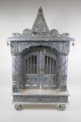 An Indian white metal veneered wooden table top shrine, 46 x 26cm, 82cm high