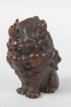 An oriental cast bronze stylised figure of a kylin, 6cm high