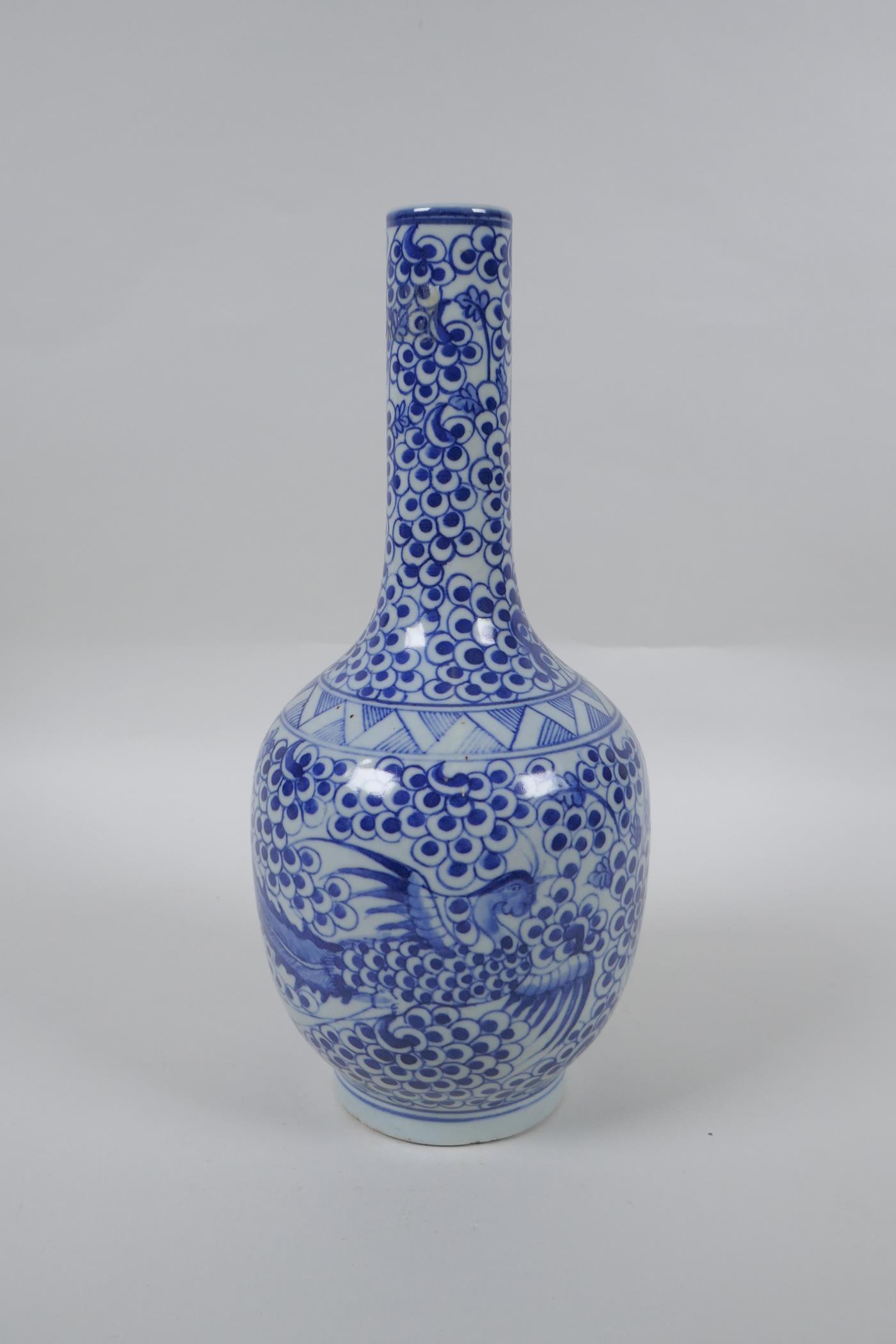 A Chinese blue and white porcelain bottle vase with phoenix decoration, mark to base, 29cm high