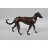 A filled bronze figure of a dog, 32cm long