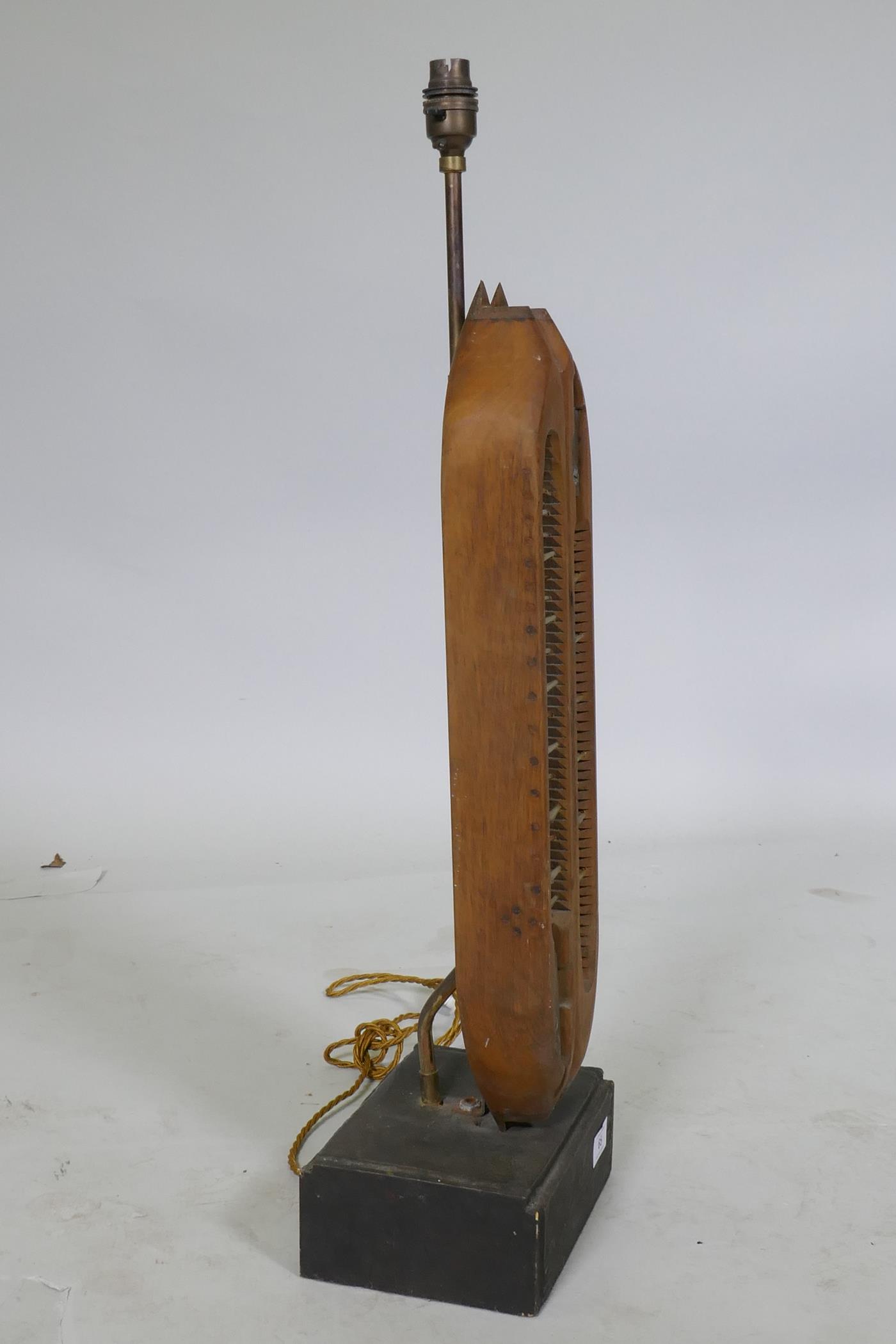 A table lamp constructed from a fragment from an industrial loom factory, mounted on a wood base, - Image 2 of 3