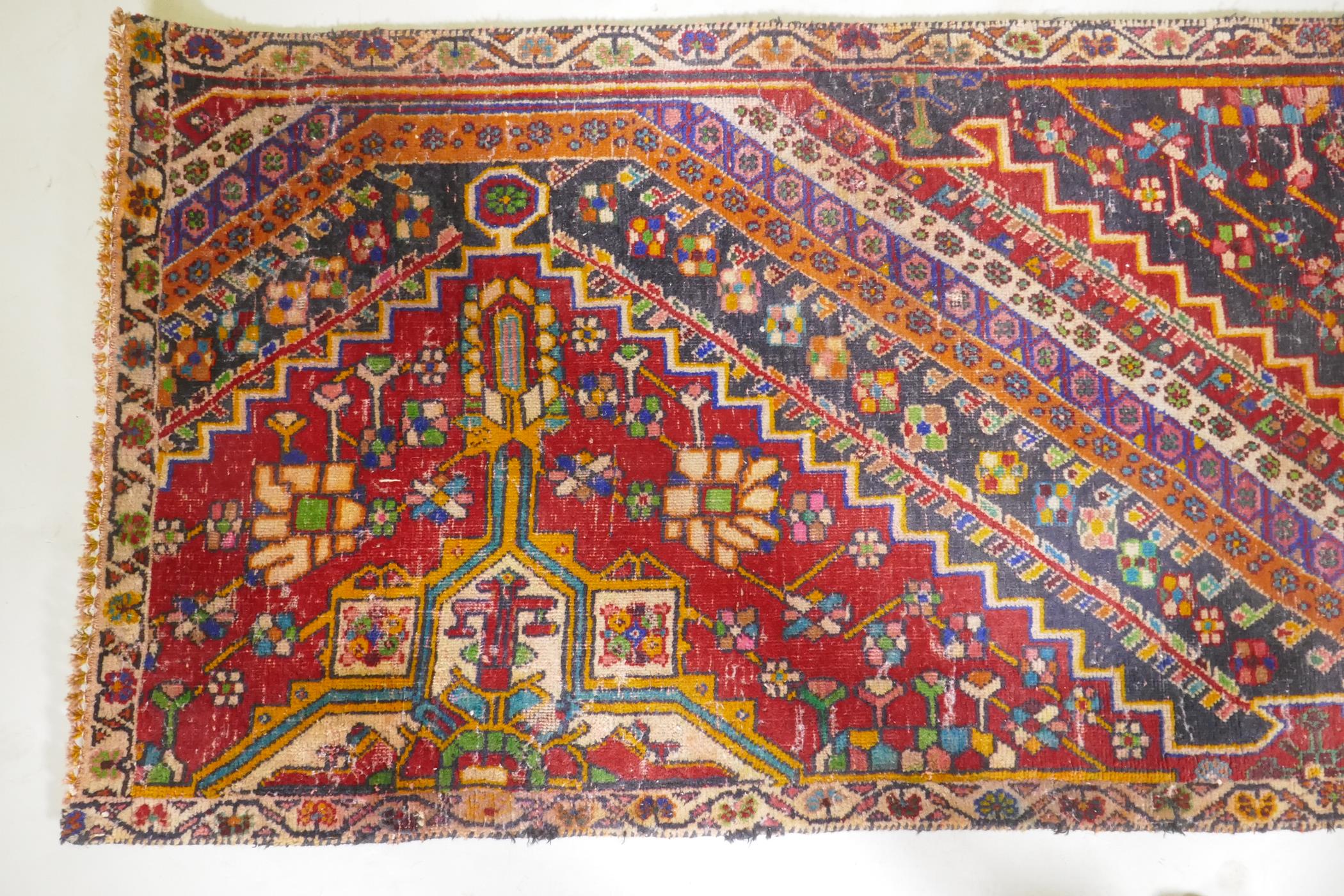 A Kashkai wool runner with geometric designs on a red field, 84 x 174 - Image 3 of 7