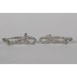 A pair of Iranian white gold and diamond set earrings, indistinctly marked, gold untested, 5.3g