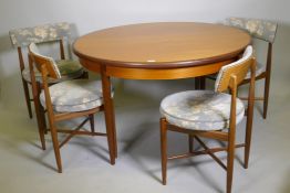 A mid century G-Plan Fresco teak dining table and four dining chairs, designed by Victor B. Wilkins,