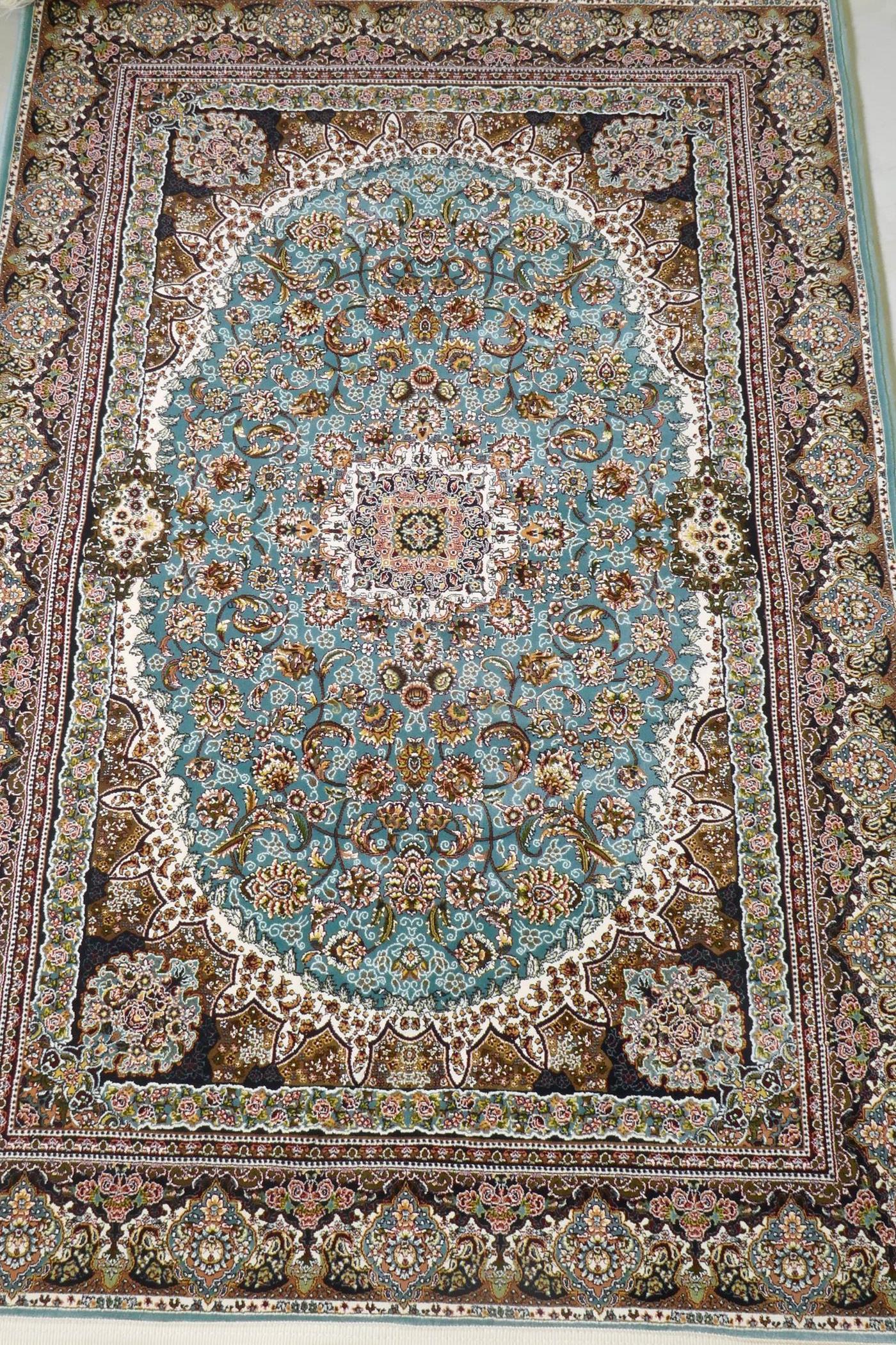 A fine woven full pile Iranian carpet with traditional floral medallion design on a turquoise field, - Image 2 of 5