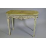 An Italian painted pine and parcel gilt side table, the shaped top with painted floral decoration