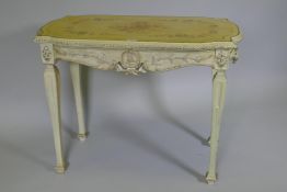 An Italian painted pine and parcel gilt side table, the shaped top with painted floral decoration
