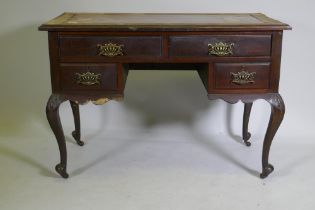 A Victorian mahogany four drawer kneehole desk, raised on carved cabriole supports, 110 x 52 x 76cm