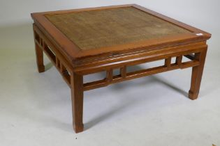 A Chinese low table with inset rattan top, 97 x 97cm, 50cm high
