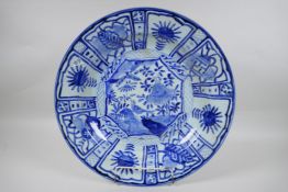 A Chinese blue and white Kraak porcelain charger decorated with birds, butterflies and flowers, 44cm
