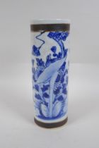 A Chinese blue and white crackleware cylinder vase with bronze style bands and decorated with a bird