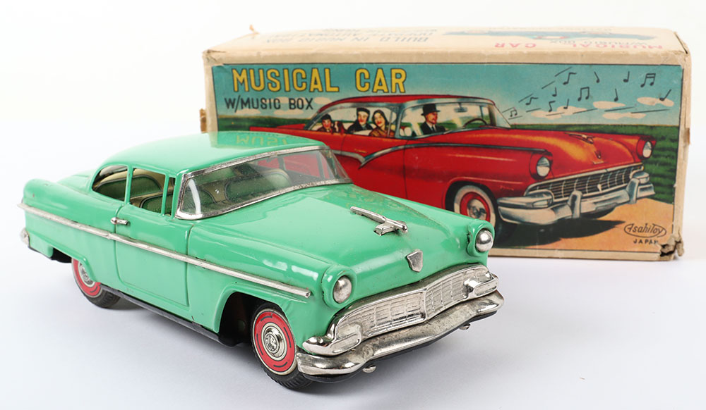 Asahi (Japan) Boxed Battery operated Tinplate Musical Car