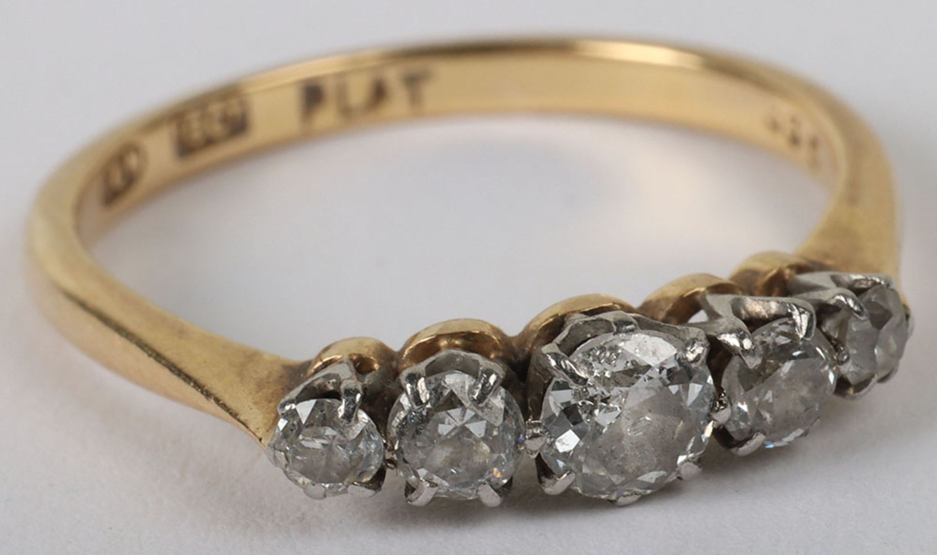 An 18ct gold five stone diamond ring