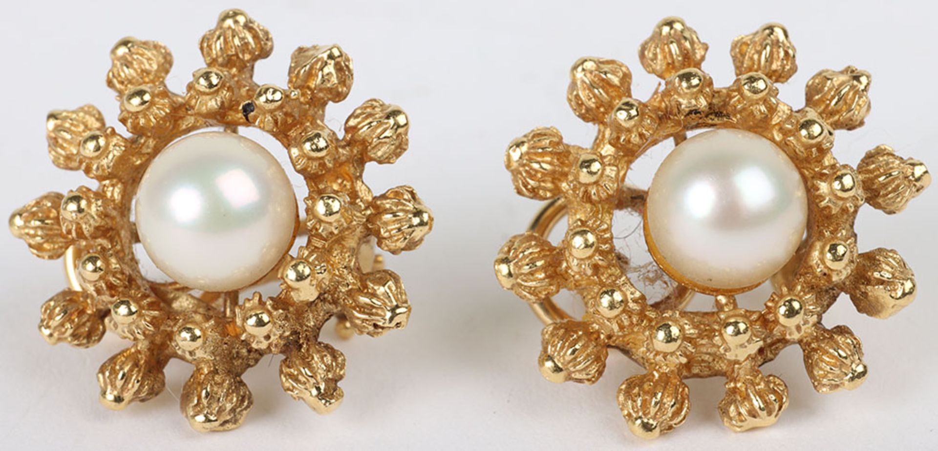 A pair of 18ct gold and pearl set earrings