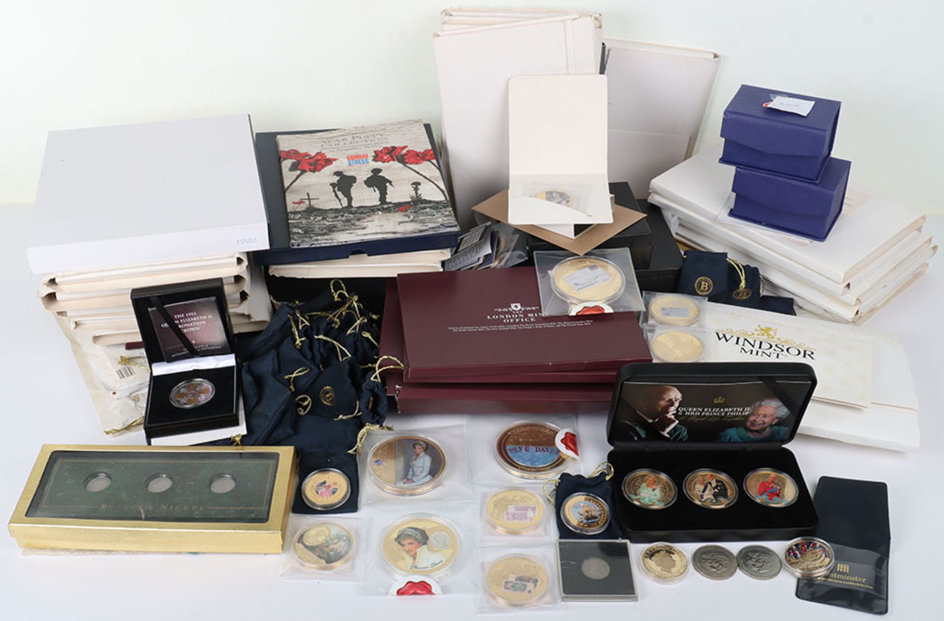 A large quantity of gold and silver plated modern coin sets and covers