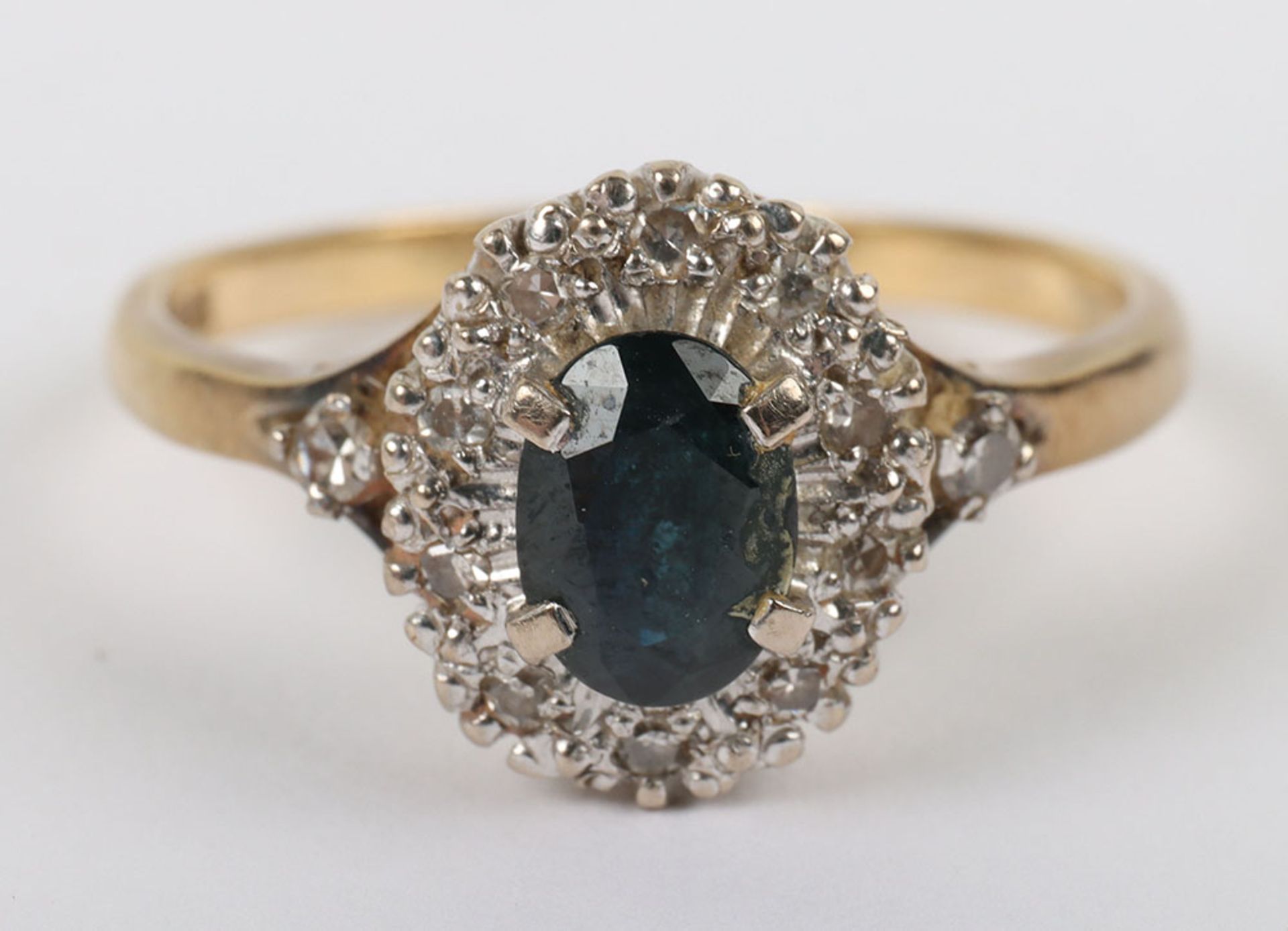 An 18ct gold, sapphire and diamond set ring