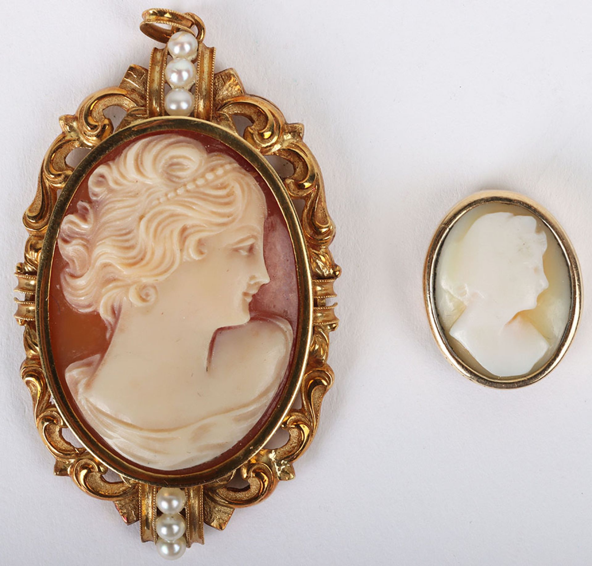 A continental 18ct gold and seed pearl framed cameo