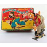 T.P.S (Japan) tinplate Clown on Roller Skates clockwork toy, 1950s