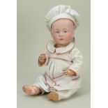 A Gebruder Heubach bisque head ‘Pouty’ character baby doll, German circa 1910,