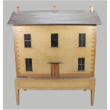 A fine and early English painted wooden dolls house on original stand, 1820s/30s,