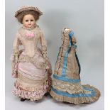 A good wax over composition shoulder head doll in original clothes, circa 1860,