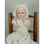 A wax over composition Mochmann baby with squeaker, German mid 19th century,
