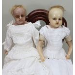 A pair of poured wax shoulder head dolls, English circa 1860,