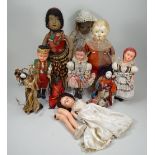 A group of various dolls,