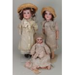 Three German bisque head girl dolls, circa 1915,