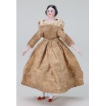 A miniature glazed china shoulder head doll on jointed wooden body, German mid 19th century,