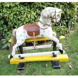 A painted and carved wooden G & J Lines Rocking Horse, English early 20th century,