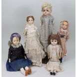 Five dolls including a wax over composition ‘Pumpkin’ head, German circa 1870,