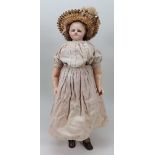 A wax over composition shoulder head doll, English circa 1850,