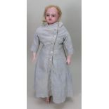 A Cremer poured wax shoulder head doll, English circa 1870,