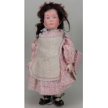 A Gebruder Heaubach 6169 bisque head ‘Pouty’ bisque head doll, German circa 1910,