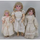 Three bisque head girl dolls, German circa 1910,