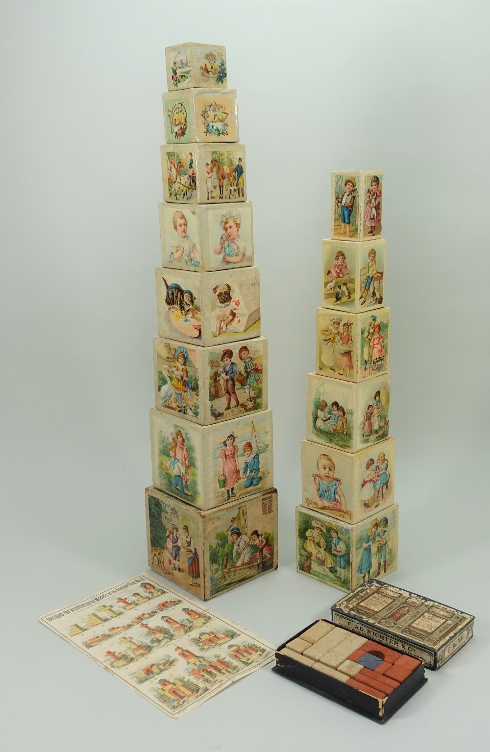 Two sets of ABC pictorial stacking cubes, German 1890s,