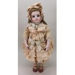 A reproduction Bru Jne bisque shoulder head artist doll,