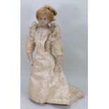 An impressive poured wax shoulder head bride doll,