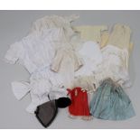 A good collection of dolls clothes,