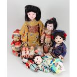 A Japanese papier-mache doll in original costume,