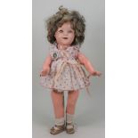 A composition ‘Shirley Temple’ doll by Ideal, American 1930s,