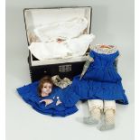 A poured wax shoulder head doll with trunk and clothing, English circa 1860,