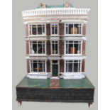 ‘Hartley Hall’ an imposing double fronted painted wooden dolls house, English circa 1875,