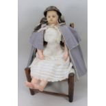 A Montanari poured wax shoulder head doll, English circa 1850,