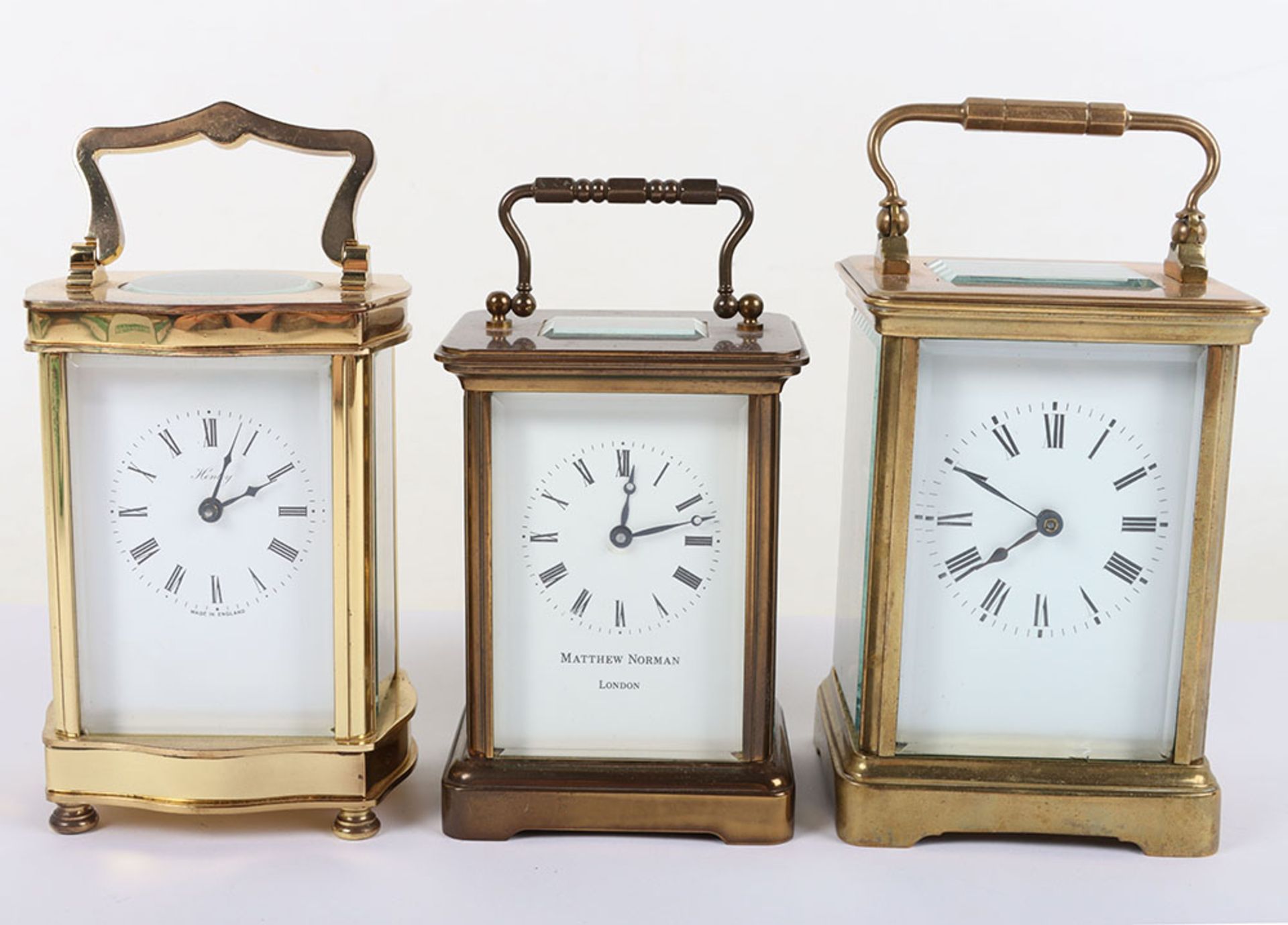 Three 20th century carriage clocks, including Henley, Matthew Norman and one other