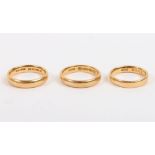 Three 22ct gold band rings