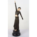 After Demetre Chiparus Footsteps, An Art Deco patinated resin and ivorine dancing lady